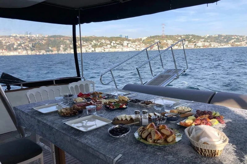 Breakfast table on a private yacht overlooking the Bosphorus